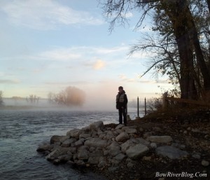 A dence fog rises along the river banks of the Bow River