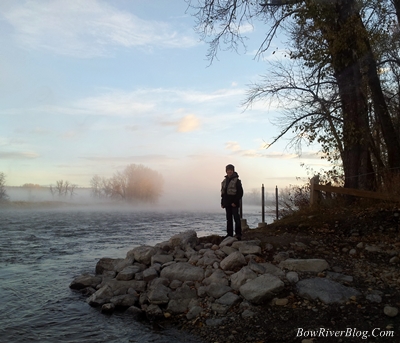 A dence fog rises along the river banks of the Bow River